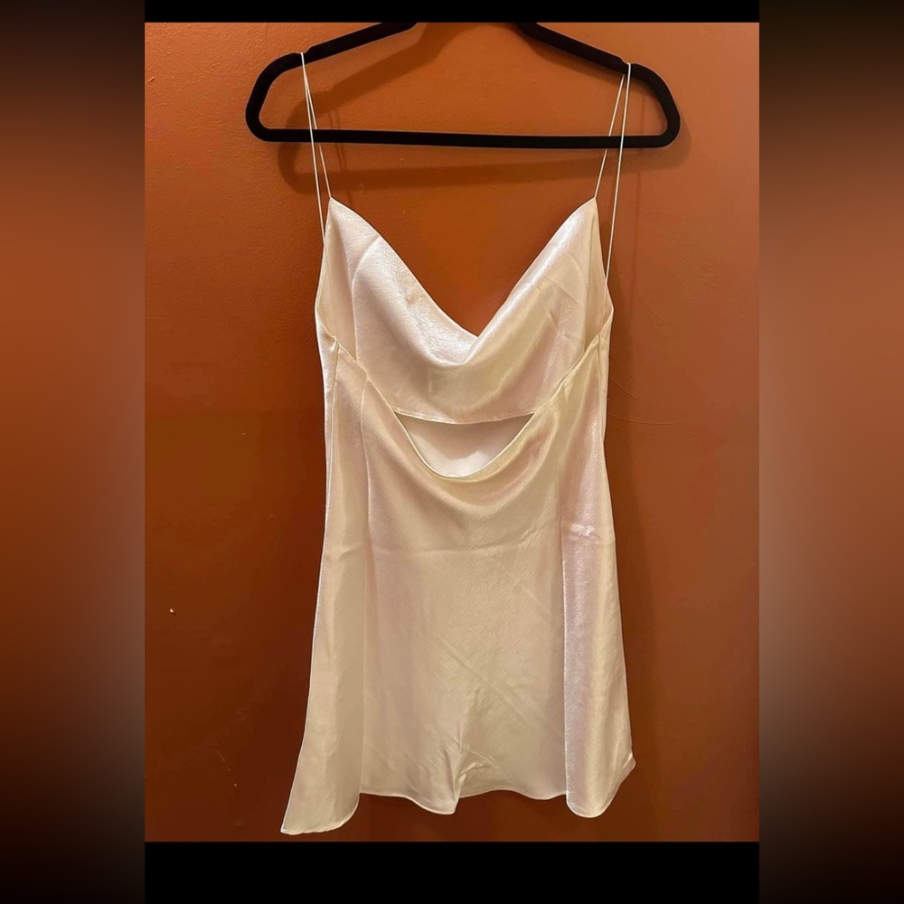 I’m selling this beautiful party dress, cream color, soft material